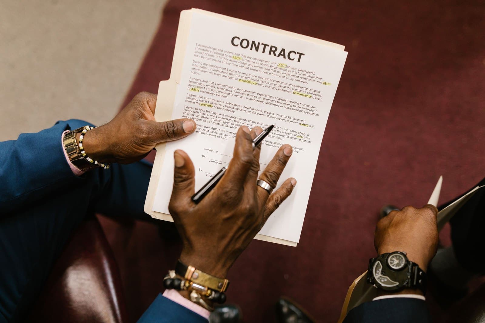 A contract page held open, ready to sign.